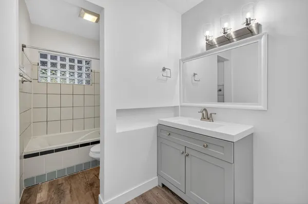 a bathroom with a bathtub and toilet