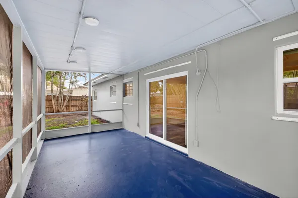 a backyard of a house with barbeque oven