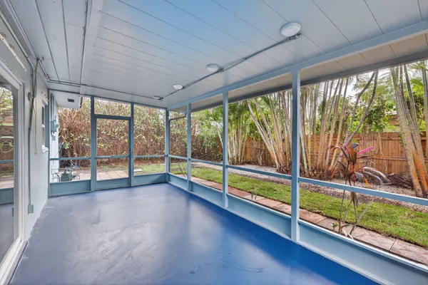 a view of a backyard with large tree