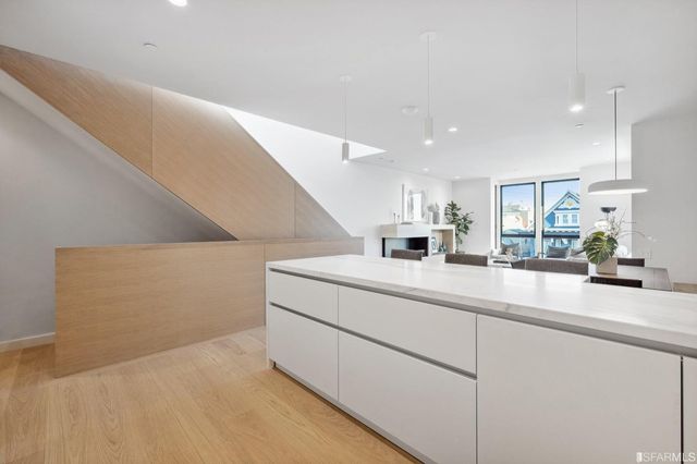 a kitchen with cabinets and window