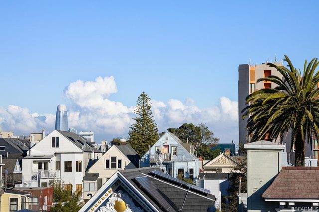 a view of multiple houses with yard