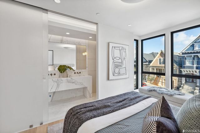 a bathroom with a sink mirror and vanity