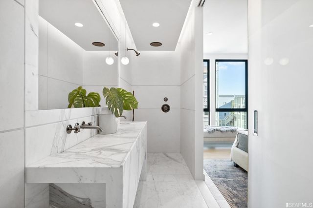 a bathroom with a bathtub and a shower