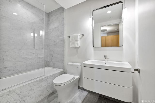 a view of a hallway with washer and dryer