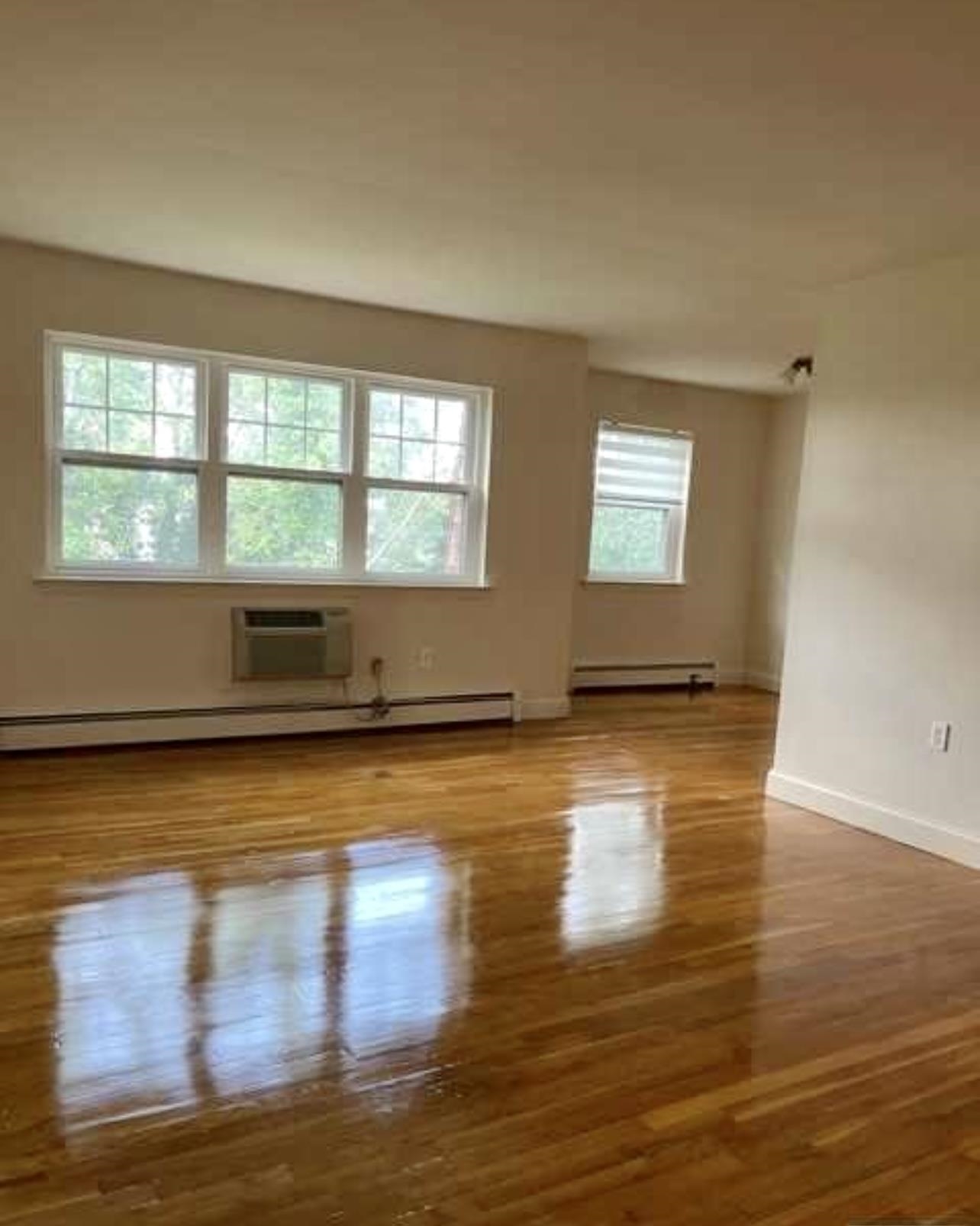 220 Meadow Lane, Unit D37 Secaucus, NJ 07094 - Photo 3 of 6 a view of empty room with wooden floor and fan