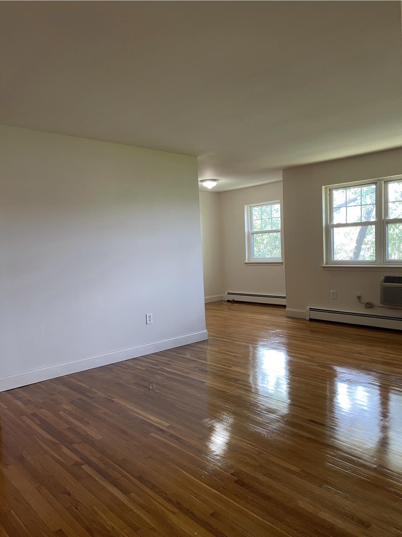 220 Meadow Lane, Unit D37 Secaucus, NJ 07094 - Photo 4 of 6 a view of empty room with wooden floor and fan