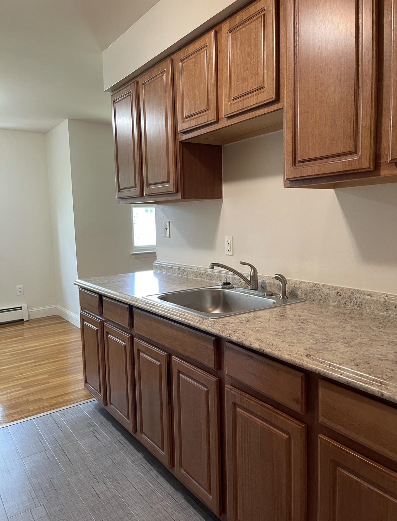 220 Meadow Lane, Unit D37 Secaucus, NJ 07094 - Photo 5 of 6 a kitchen with stainless steel appliances granite countertop a sink dishwasher stove and cabinets