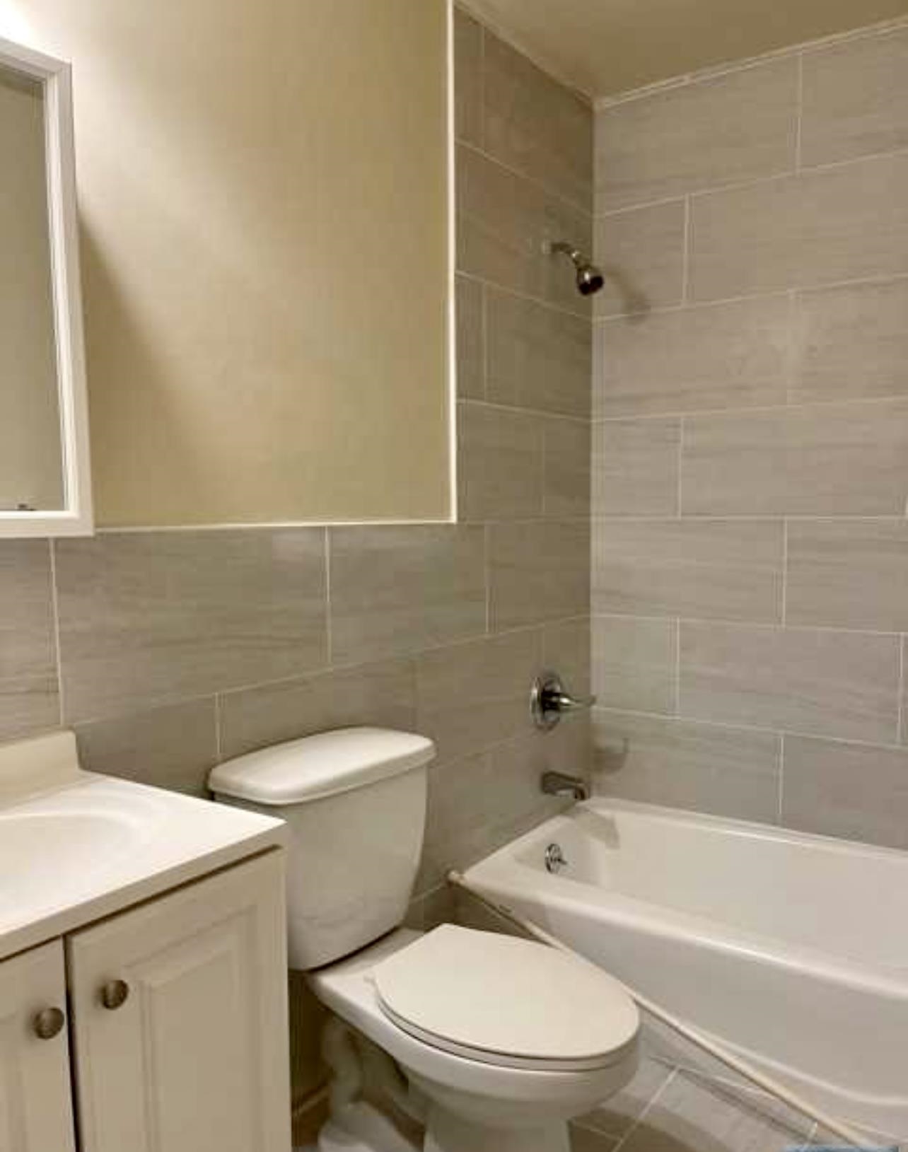 220 Meadow Lane, Unit D37 Secaucus, NJ 07094 - Photo 6 of 6 a white toilet and tub sitting next to a bathroom sink