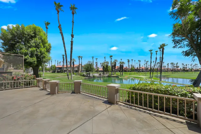 a view of a garden with sitting area