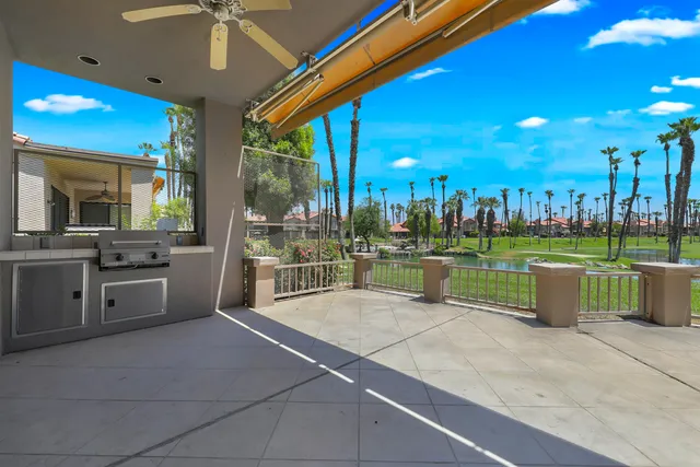 a swimming pool with lawn chairs and outdoor view