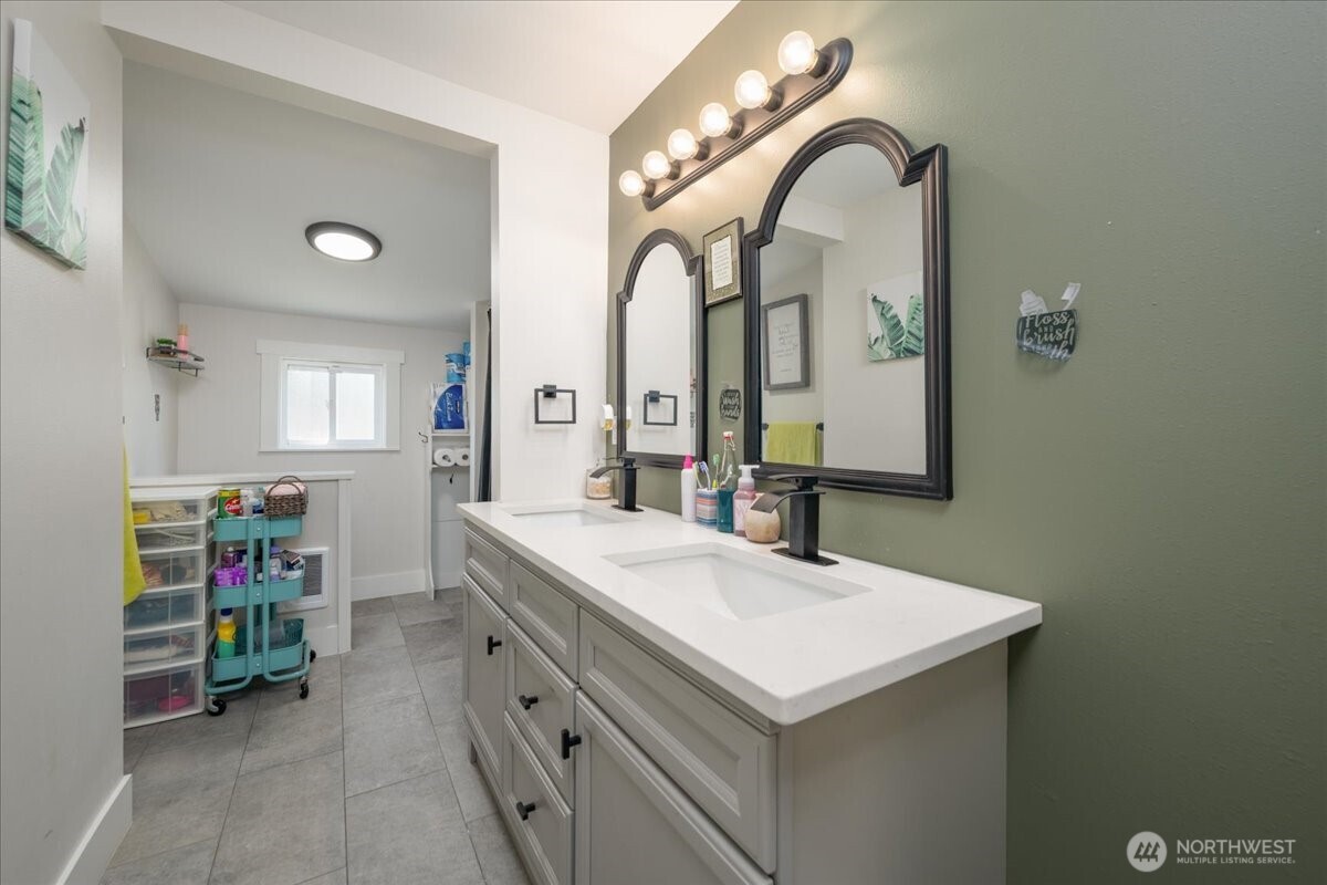 533 Fidalgo Street Sedro-Woolley, WA 98284 - Photo 15 of 37 a bathroom with a double vanity sink and a mirror