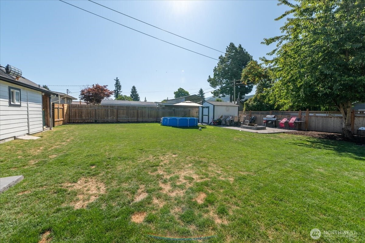 533 Fidalgo Street Sedro-Woolley, WA 98284 - Photo 21 of 37 a view of a backyard with a garden and trees
