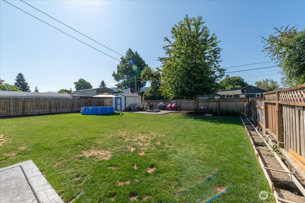 533 Fidalgo Street Sedro-Woolley, WA 98284 - Photo 22 of 37 a view of yard with swimming pool and green space