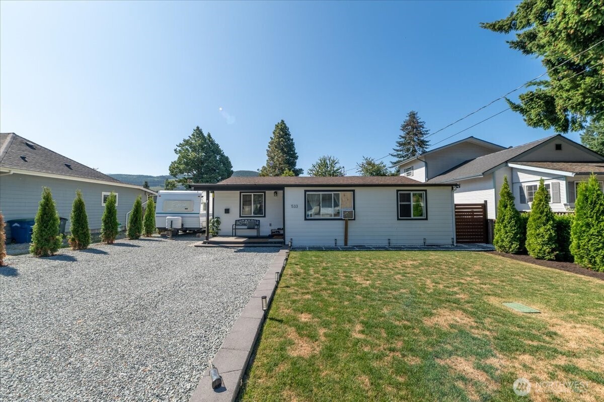 533 Fidalgo Street Sedro-Woolley, WA 98284 - Photo 33 of 37 a view of a house with a yard and potted plants