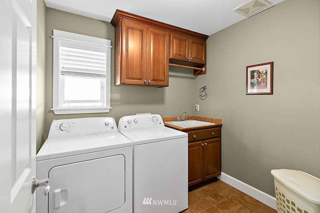 721 South 37th Place Renton, WA 98055 - Photo 22 of 34 a utility room with dryer and washer