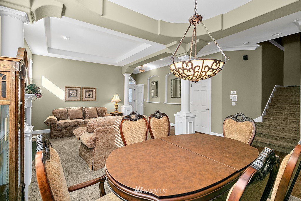721 South 37th Place Renton, WA 98055 - Photo 8 of 34 a living room with furniture a chandelier and a window