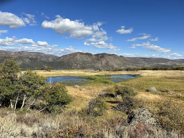 a view of a lake with mountains in the background