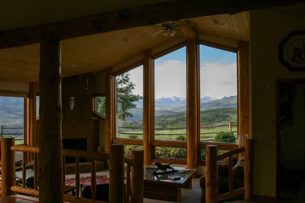 a view of a room with a large window