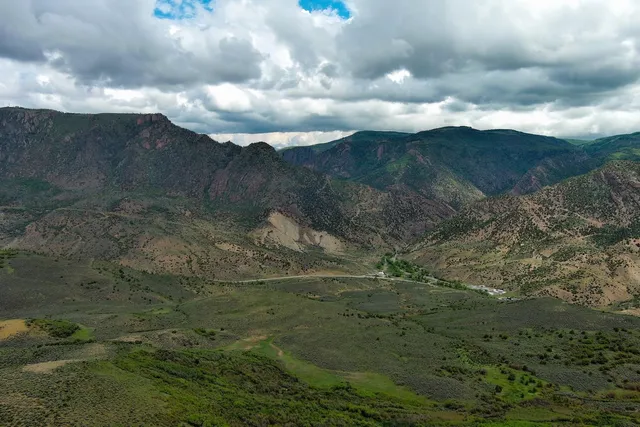 a view of a lake with a yard