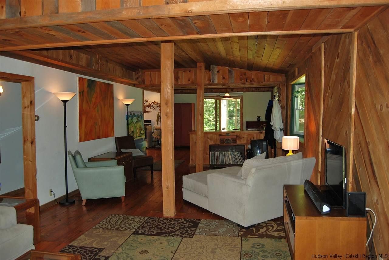 79 Iken Road Kerhonkson, NY 12446 - Photo 13 of 24 a living room with furniture and a large window