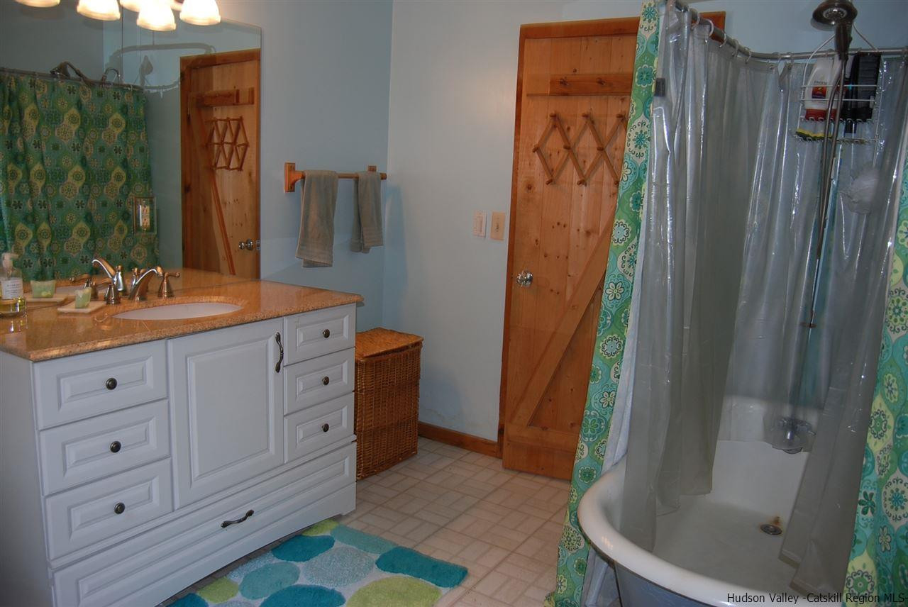 79 Iken Road Kerhonkson, NY 12446 - Photo 19 of 24 a bathroom with a sink and a mirror