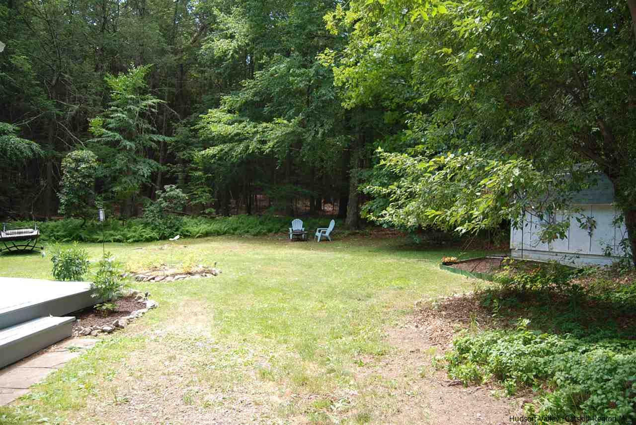 79 Iken Road Kerhonkson, NY 12446 - Photo 5 of 24 a view of a garden with large trees