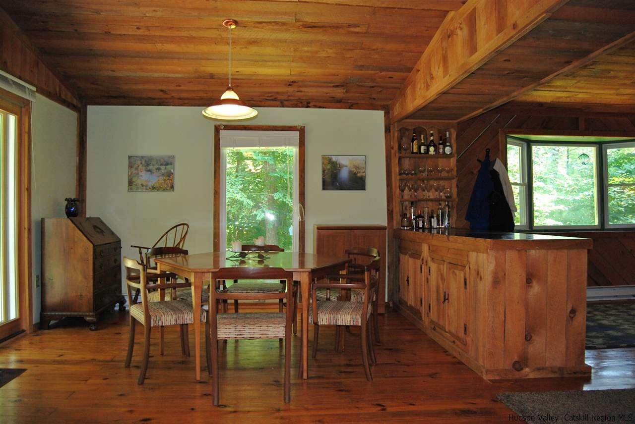 79 Iken Road Kerhonkson, NY 12446 - Photo 6 of 24 a view of a dining room with furniture window and wooden floor