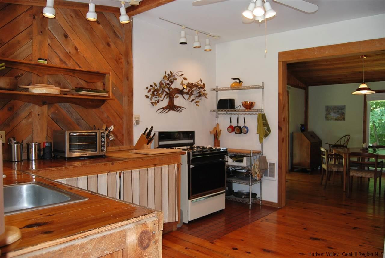 79 Iken Road Kerhonkson, NY 12446 - Photo 8 of 24 a view of a living room and kitchen