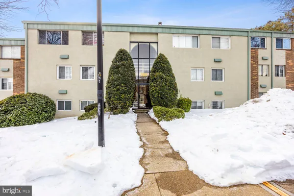 a view of spacious bathroom with a bathtub