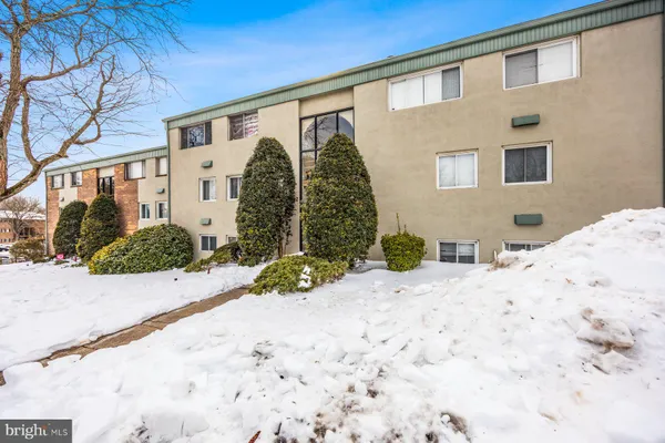 a view of a house with a snow on the road