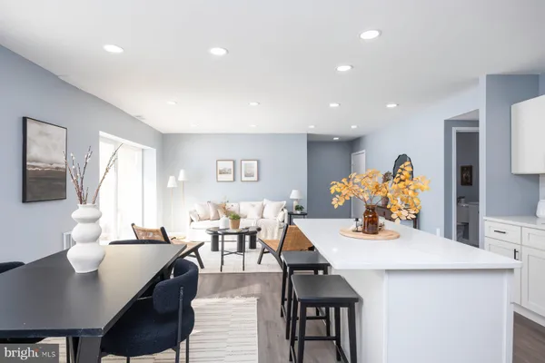 a dining room with furniture and window