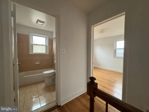 a view of a bathroom from a hallway