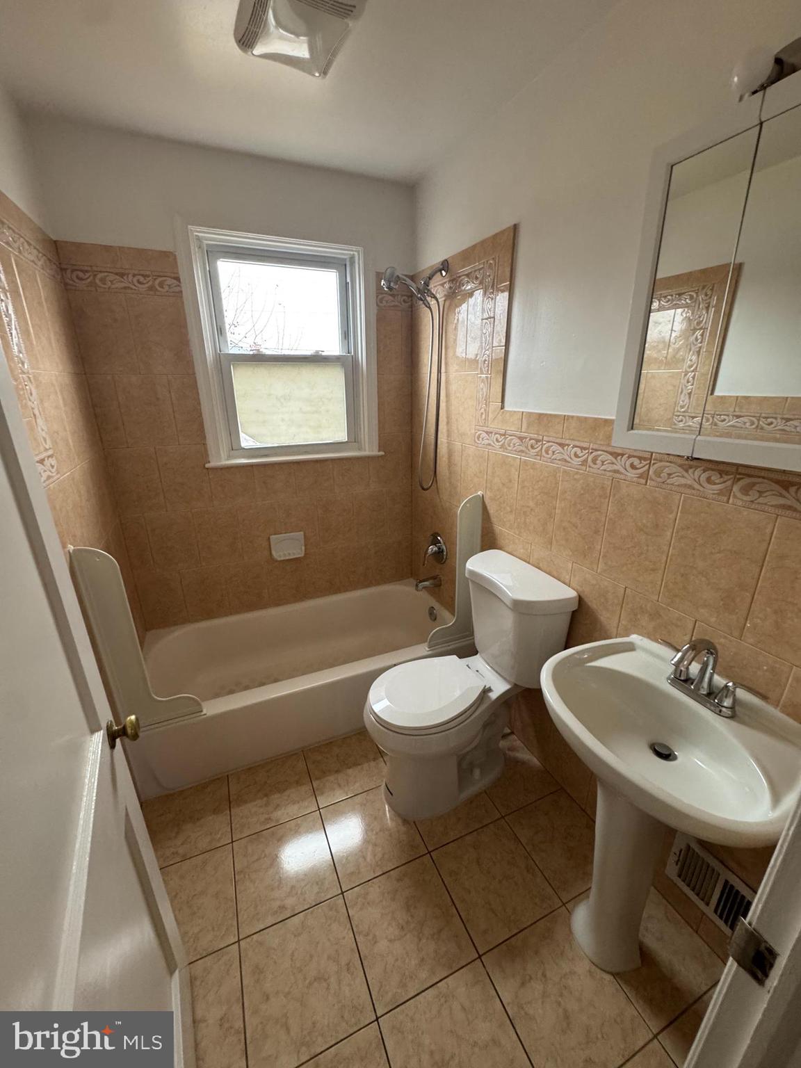 2167 Coralthorn Road Middle River, MD 21220 - Photo 16 of 23 a bathroom with a sink a toilet and a bathtub