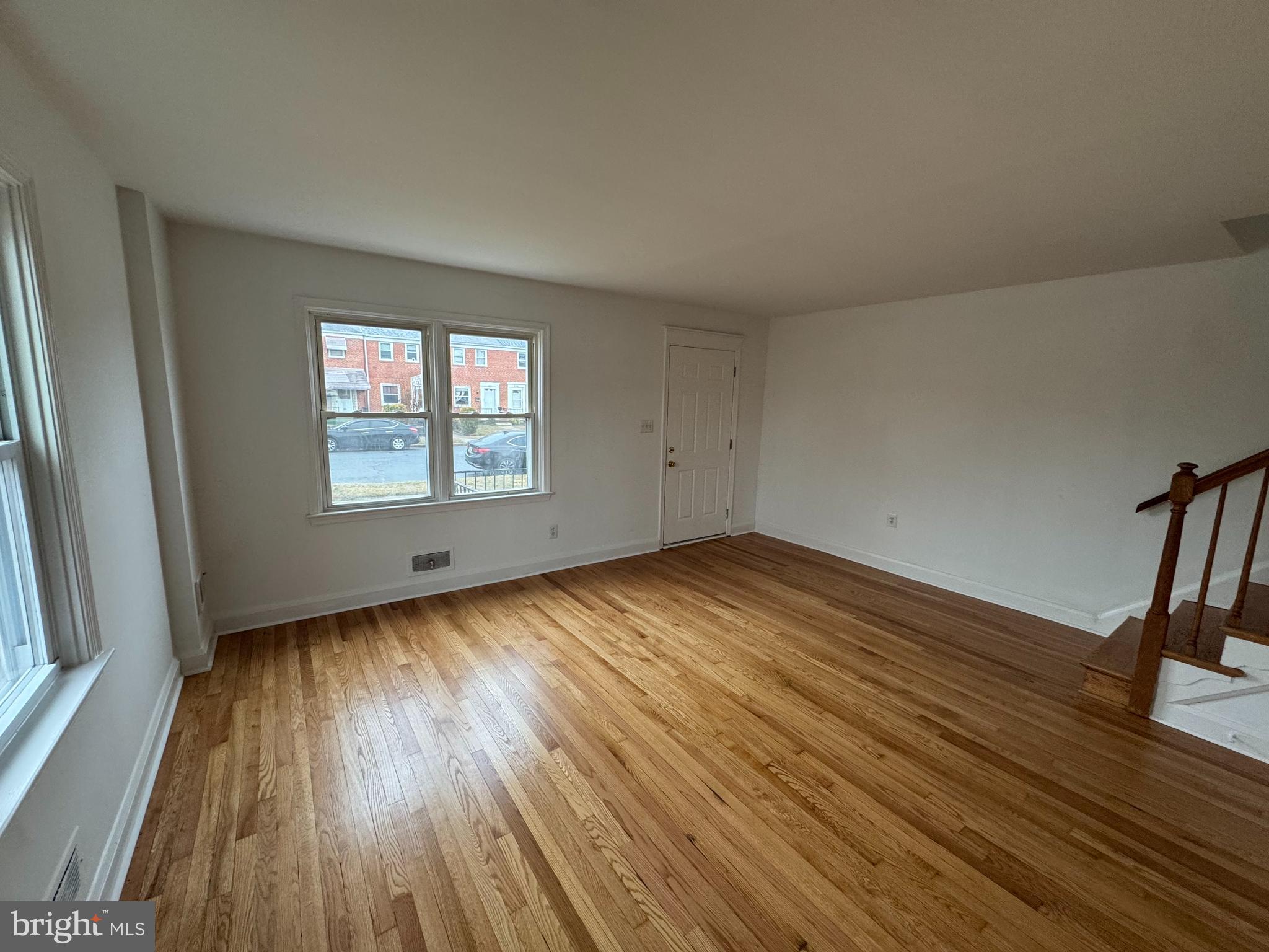 2167 Coralthorn Road Middle River, MD 21220 - Photo 3 of 23 an empty room with wooden floor and windows