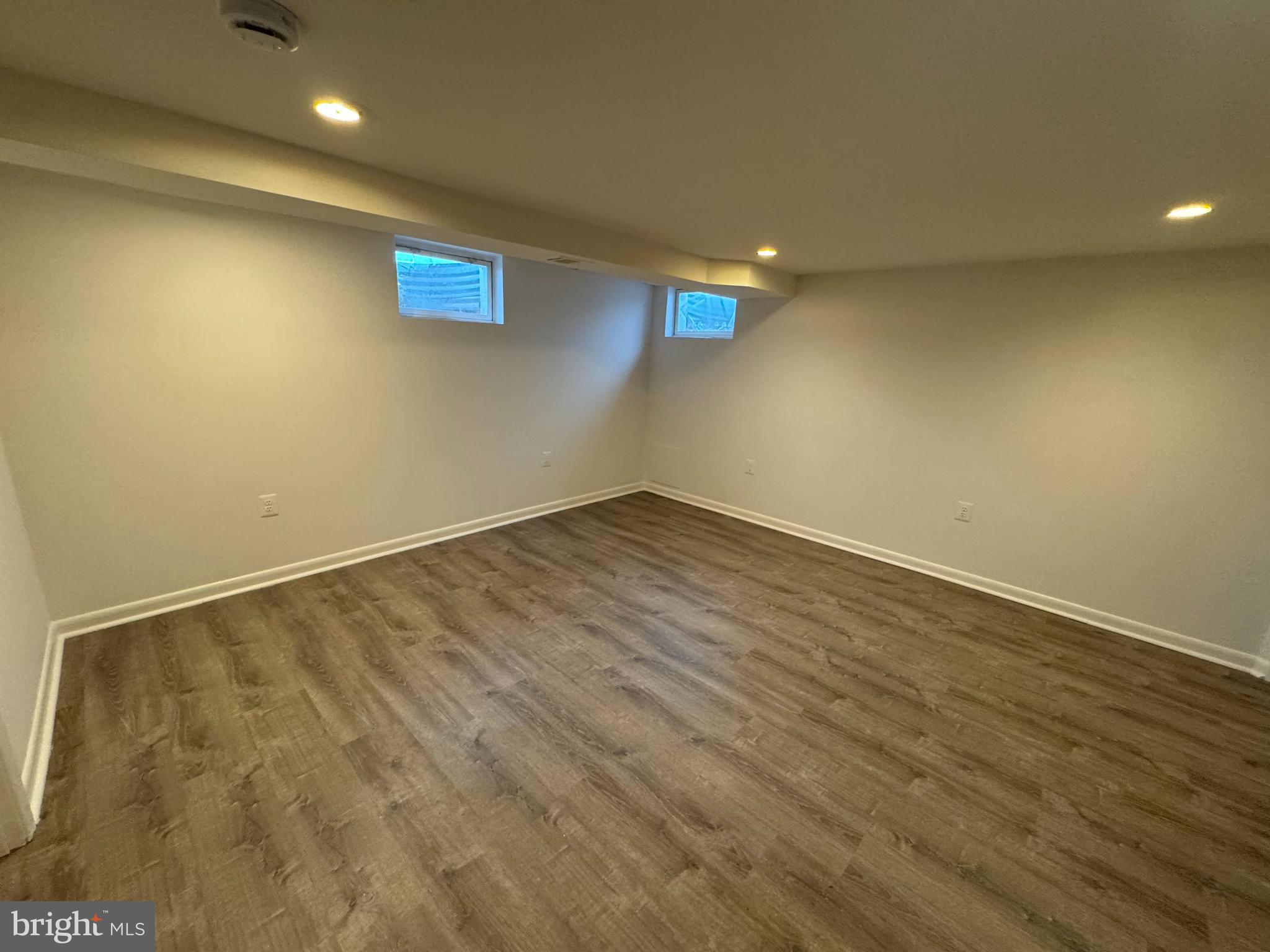 2167 Coralthorn Road Middle River, MD 21220 - Photo 8 of 23 an empty room with wooden floor and windows