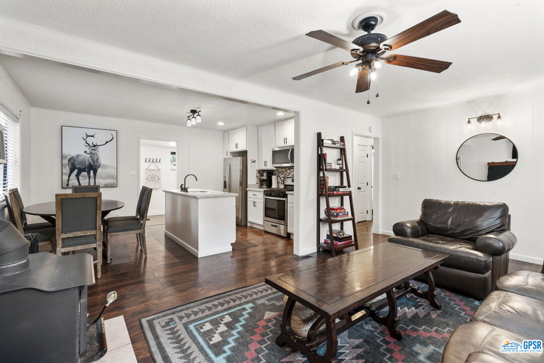 53335 Meadow Drive Idyllwild, CA 92549 - Photo 11 of 35 a living room with furniture and wooden floor