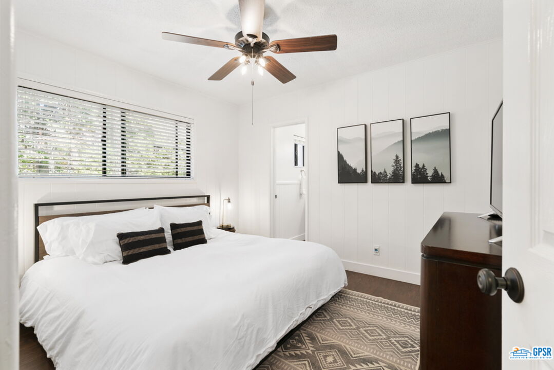 53335 Meadow Drive Idyllwild, CA 92549 - Photo 25 of 35 a bedroom with a large bed and a window