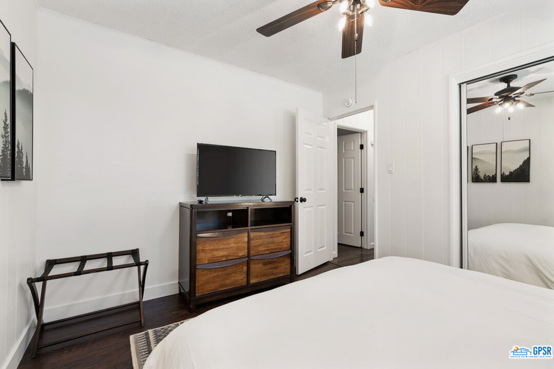 53335 Meadow Drive Idyllwild, CA 92549 - Photo 28 of 35 a bedroom with a bed and a flat screen tv