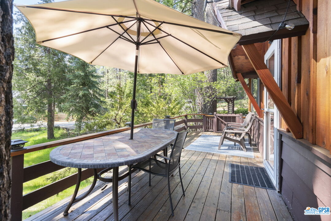 53335 Meadow Drive Idyllwild, CA 92549 - Photo 7 of 35 a view of balcony with chairs and wooden floor
