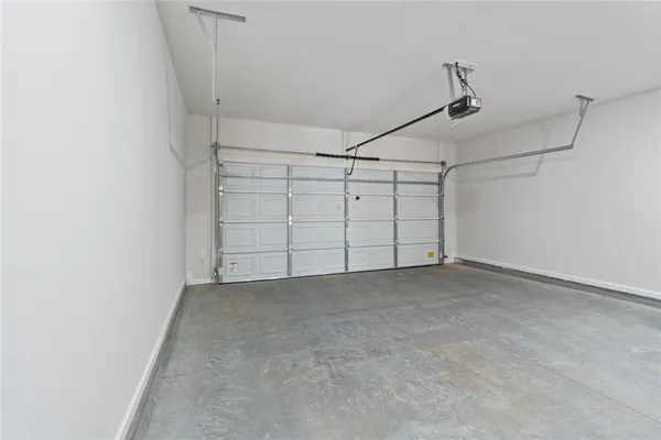 a view of a hallway with closet and front door