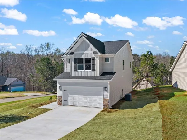 a front view of a house with a yard