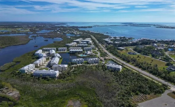 an aerial view of a house with a lake view