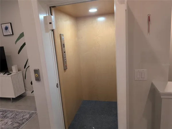 a view of a hallway with elevator