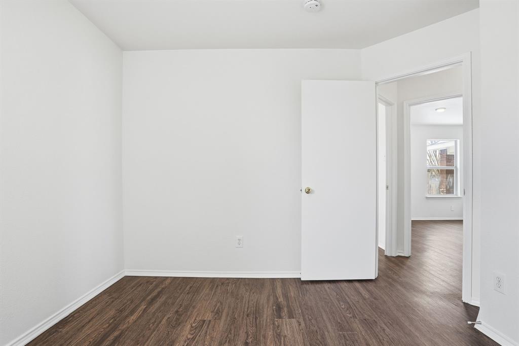 1000 Caleb Street Burleson, TX 76028 - Photo 15 of 27 a view of a room with wooden floor
