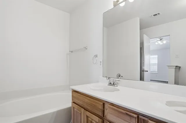 a bathroom with a sink and a bathtub