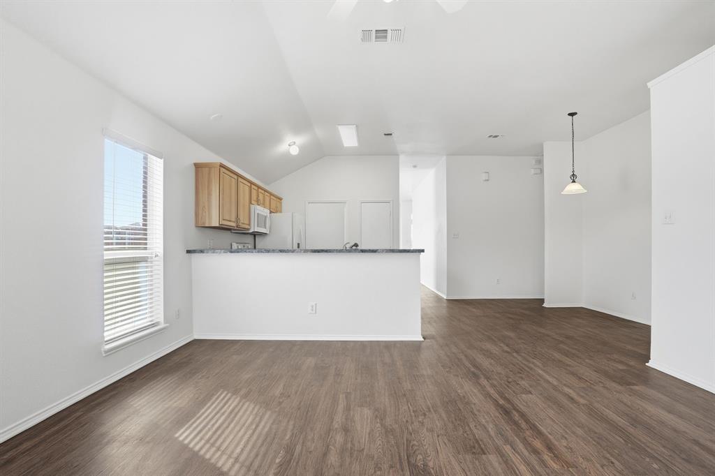 1000 Caleb Street Burleson, TX 76028 - Photo 10 of 27 a view of kitchen with wooden floor and electronic appliances