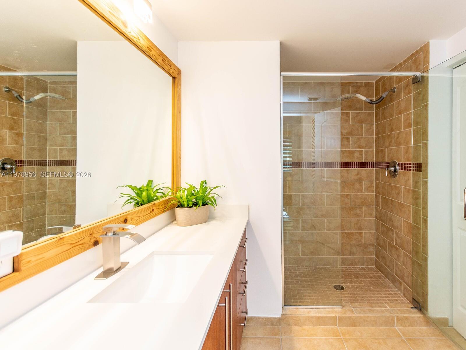 7350 Southwest 89th Street, Unit 719S Miami, FL 33156 - Photo 24 of 30 a bathroom with a shower and a sink