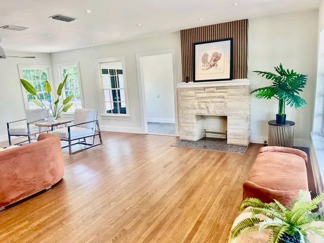 a living room with furniture and a fireplace
