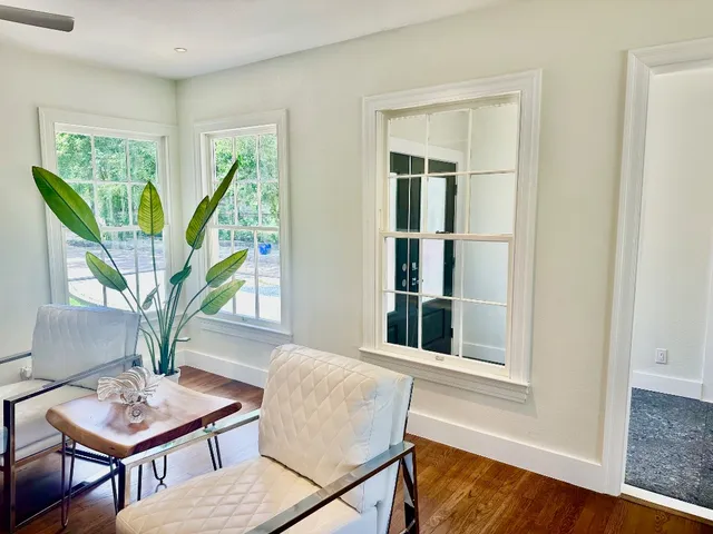 a living room with furniture and a window