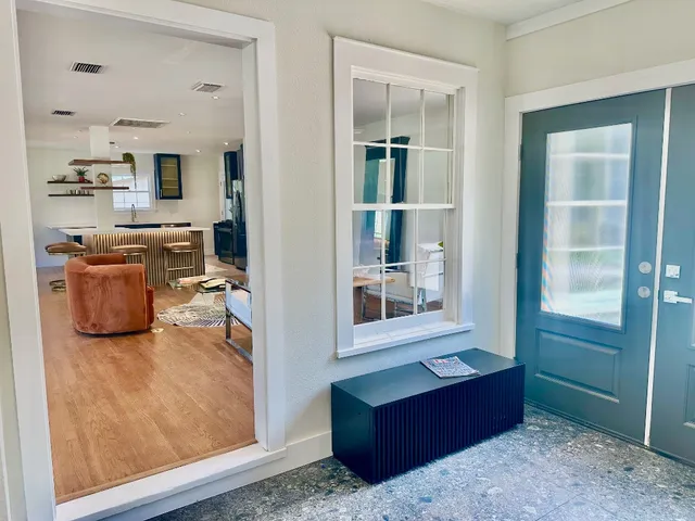 a view of living room filled with furniture and window